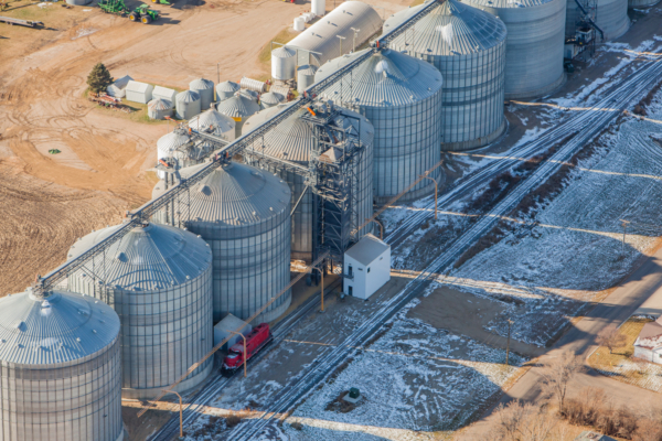 Farmers Coop Elevator Co. South elevator in Lidgerwood, ND, with new bulk weigh loadout scale and grain handling equipment near enter of photo.
