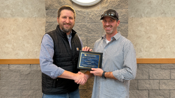 Adam Hendricks (right) accepted the Grain Crops Science Service Award for Hendricks Farms. Photo by Jennifer Elwell. Image courtesy of the University of Kentucky Martin-Gatton College.