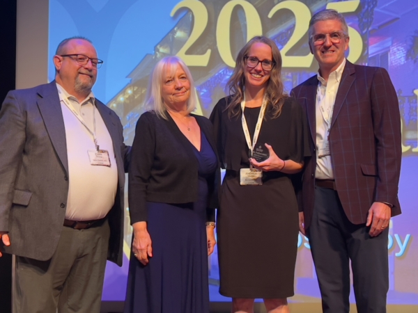 From left: Evan Trump, Paula Fetherston (accepting NAMA Honorary Member Award on behalf of Dan Fetherston), Andrea Vauble, and NAMA Chair Tedd Kruse (ADM Milling and Baking Solutions).