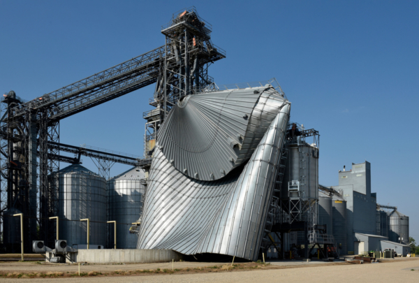A powerful storm produced strong winds on June 20, 2025, that heavily damaged this grain bin at the elevator in Eldridge, N.D. (Dan Koeck/For the North Dakota Monitor)
