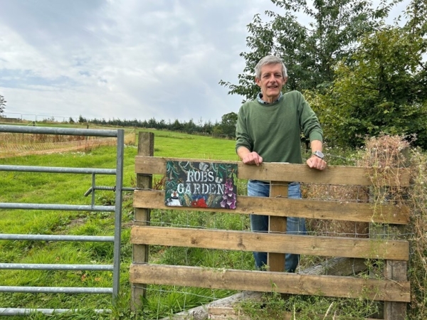 Alex Hilton in Rob's Garden. Image courtesy of SRUC.