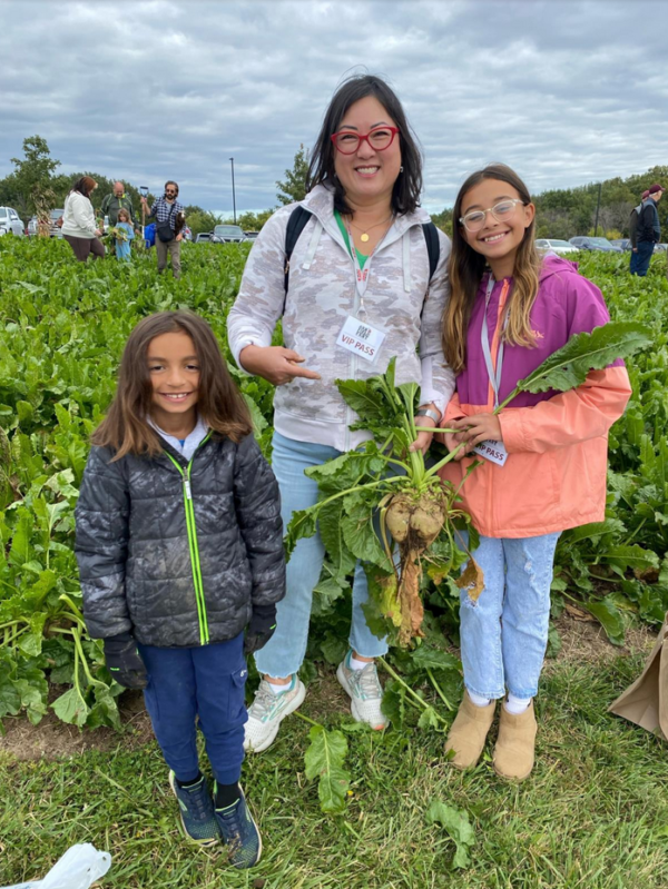 Participants proudly display a freshly harvested sugarbeet highlighting the focus on agricultural innovation and community engagement at the Field Fest event presented by KWS Seeds.