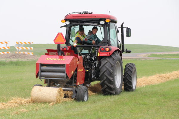 Youth learn the basics of safe tractor and machinery operation at an NDSU Extension youth farm safety camp. Photo credit: NDSU.