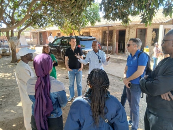 The U.S. Grains & BioProducts Council (USGBC) recently held concurrent training sessions for poultry and dairy sector leaders in Senegal. USGBC Deputy Regional Director for Africa Mohamed Salah Bouthour (second from right) is pictured at a visit to a dairy farm to analyze and improve production methods. Image courtesy of USGBC.