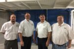 Zach Stuchlik, operations manager; Kent Nolting, feed department manager; Dan Dix, cooperative general manager; and Dave Krienke, Rowan feed mill manager