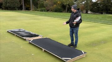 Dominic Petrella explains how shade cloths are used to provide shade for turfgrass studies at The Ohio State University campus in Wooster. (Chris Lusvardi photos)