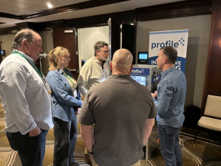 Steve DeJong, right, of Profile Industries provides an equipment demonstration during the Trade Show.