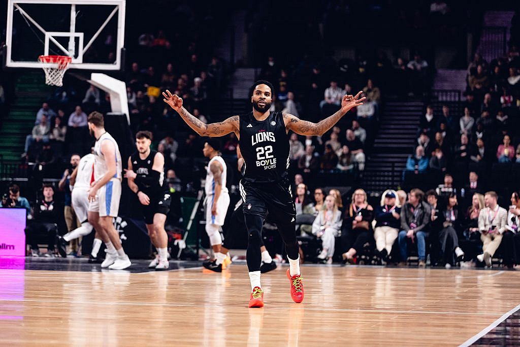 Tarik Phillip of the London Lions celebrates a three-point basket in the Super League Basketball Cup Final against Manchester Basketball. 
