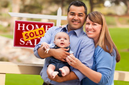 family-in-front-of-home