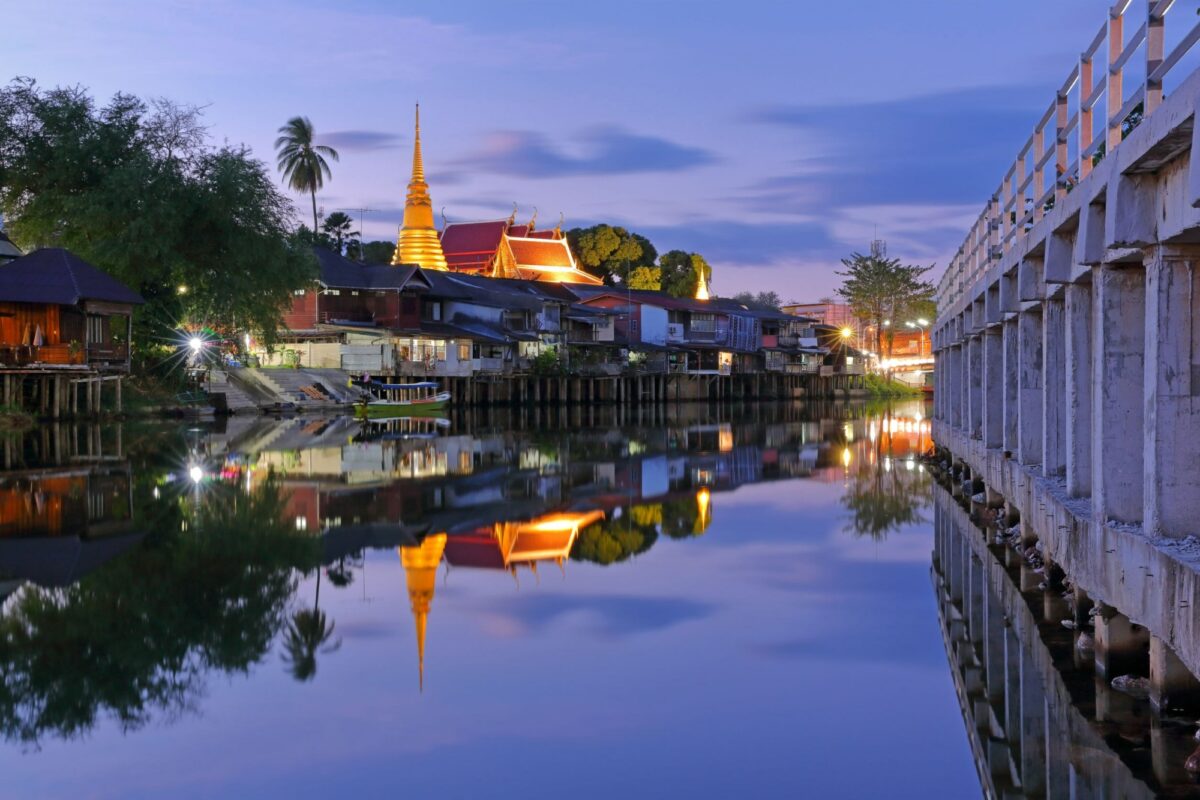 Chanthaboon with landmark with old building village and golden temple in during the night time beautiful and wonderful water reflection at Chanthaburi Province Thailand