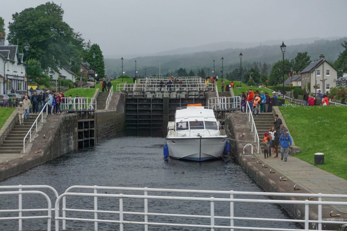 Family Fort Augustus Scotland UK Crowds of people visit the Caledonian Canal locks at the south side of Loch Ness on a cloudy day