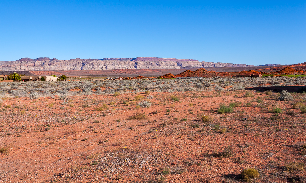 27576 Beautiful lot on a quiet cul-de-sac in The Dunes at Sand Hollow with amazing views of the red rocks and
the golf course. Water conservancy fees have been paid! For additional property and agent information, click the virtual tour link.