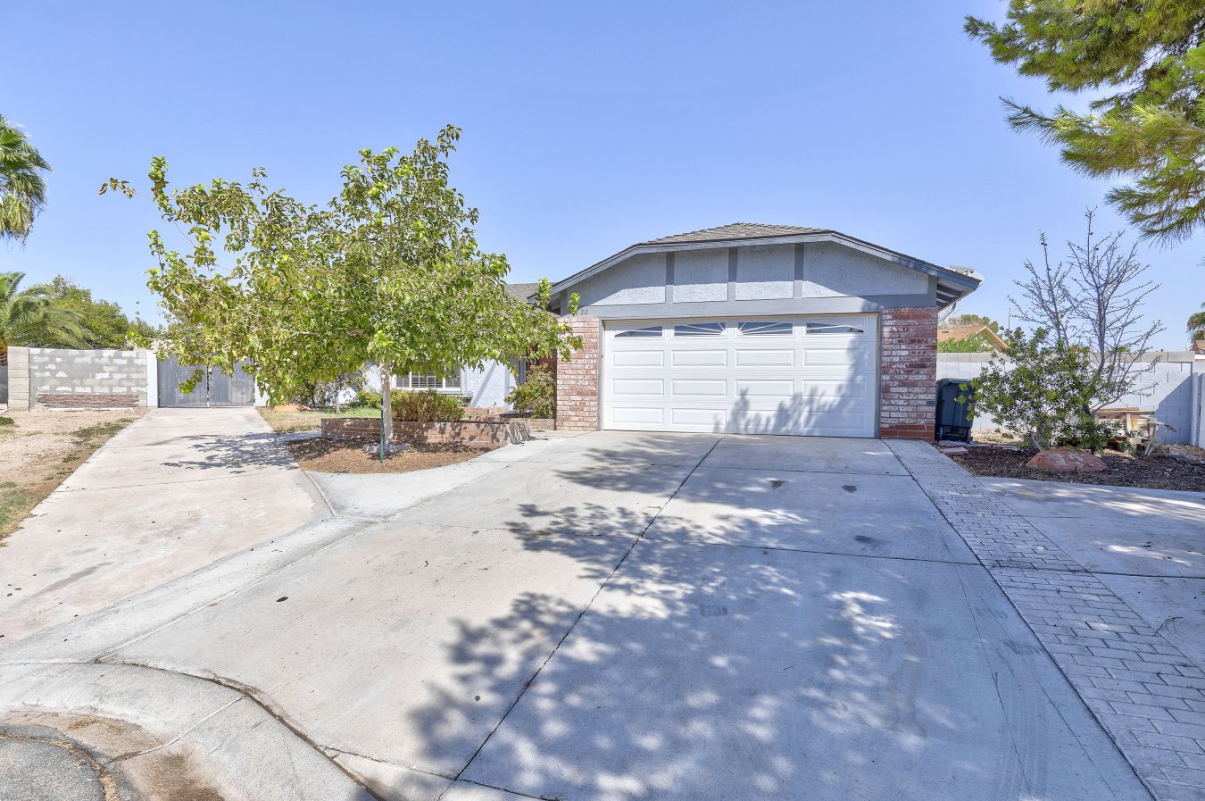 28033 Incredible custom upgrades in this former model home. Original owner, but newer remodeled features include custom cabinets in the kitchen and adjoining dining room/family room. Gorgeous remodeled bathrooms. Tile and pergo brand wood flooring abound. Gated rv parking area with room for multiple vehicles. Rolladen shutters and pella dual pane/ low e windows in every room account for the low utility bills. Gazebo is perfect for adding a spa.