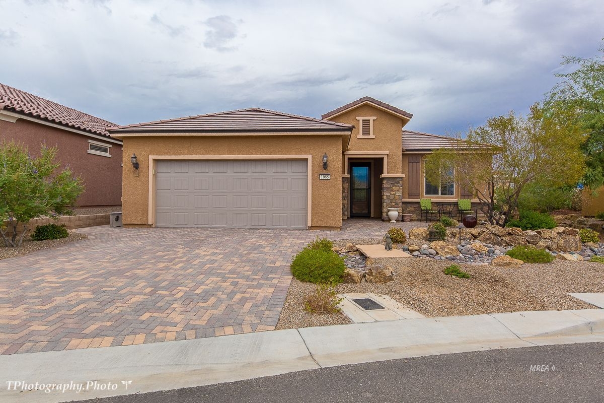 Beautiful upgraded home in Sun City. This beautiful Sanctuary home is gorgeously landscape. Backyard has a side view Conestoga's Golf course on the 5th hole. It has a beautiful propane fireplace on the patio for wonderful entertaining. The large fountain in the backyard stays. This home has over $65,000 in upgrades. The kitchen has upgraded cabinets and granite. Including reverse osmosis. The Living room has a beautiful full length wet bar also great for entertaining. Water softener, refrigerators, washer and dryer are included. This upgraded garage is everyone's dream from the built in air conditioning, fan, cupboards and painted floors. Don't miss this opportunity to have your dream home.
