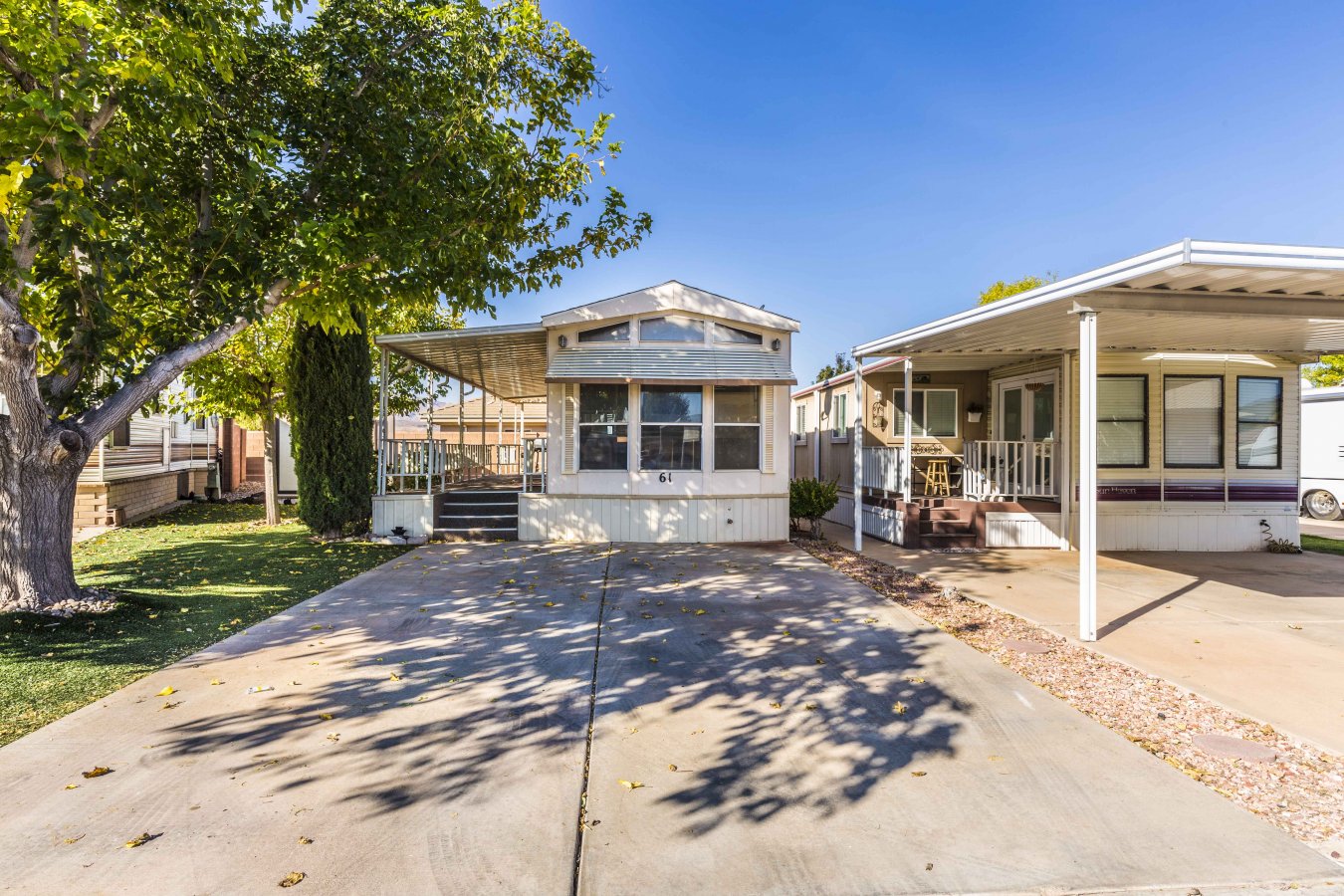22672 Located in the Dixie Downs RV Resort. Shows great, beams with curb appeal. Lot size is larger than most in subdivision. No neighbors behind. Plush artificial grass yard, 3 mature trees provide plenty of shade. Huge almost 300 sqft covered deck bordered by rose bushes. Brand new carpet, paint, ceiling fan. Storage shed and firepit. Cheap dues at only $65 a month. Includes 2 clubhouses, pool, spa.