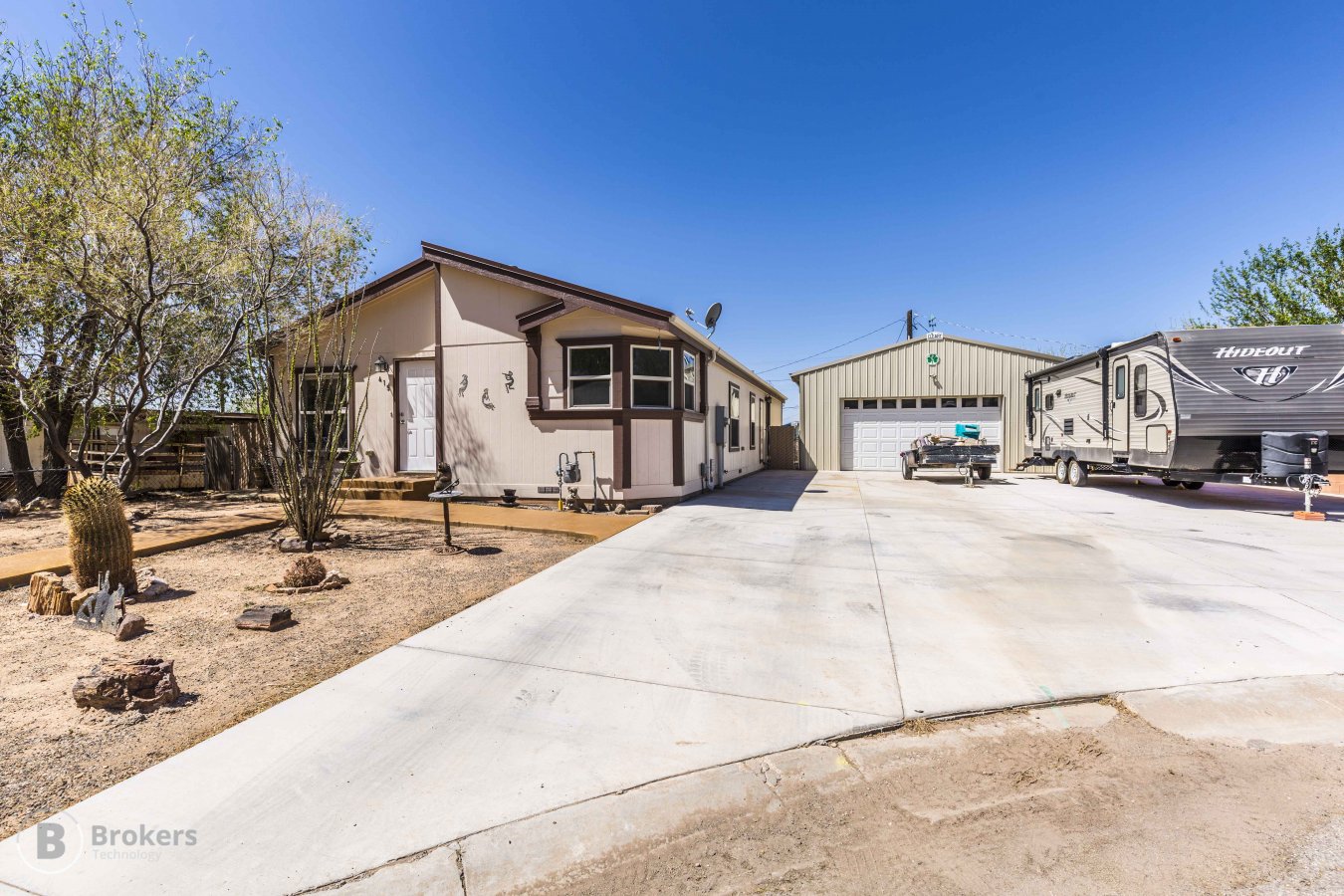 25497 Beautiful, updated home and well kept. 27 x 32 Garage with swamp cooler and fully insulated. RV pad and hook ups. Home and garage have metal roof.