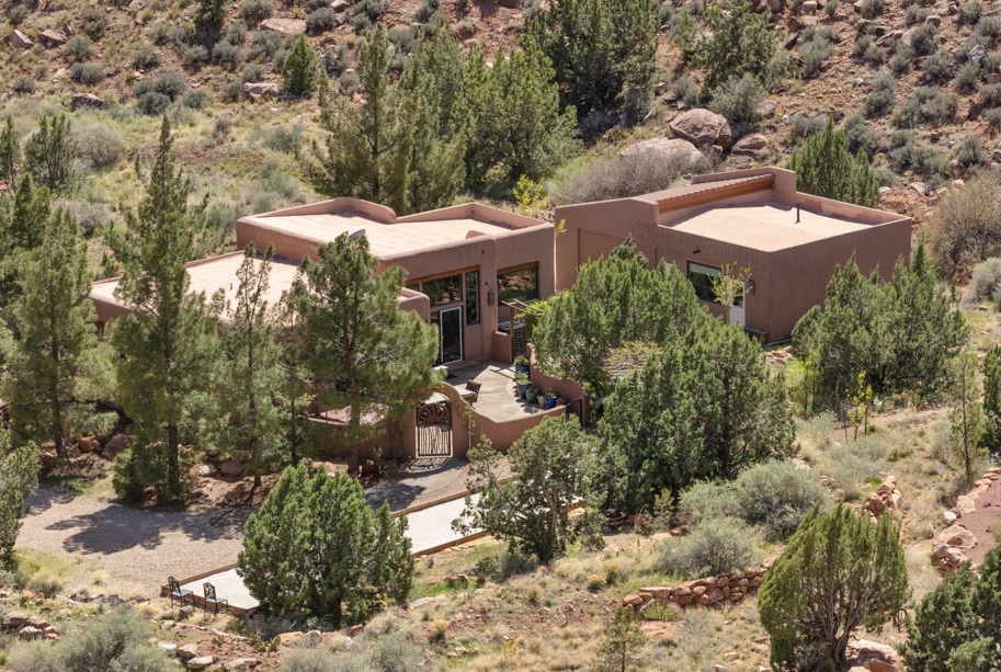 25700 Standing in the kitchen/great room you can look out the well placed windows and see Zion National Park's West Temple in one direction and Eagle's Crags out the other. The views combined with the privacy the Mature Tree's provide is unique and spectacular. The current owners built this dream home and recently finished the basement. The Art Studio is attached to the garage, but has a separate entrance. Home was built using ICF insulated concrete forms, one of the strongest and most energy efficient building materials. Provides a R-40 rating.