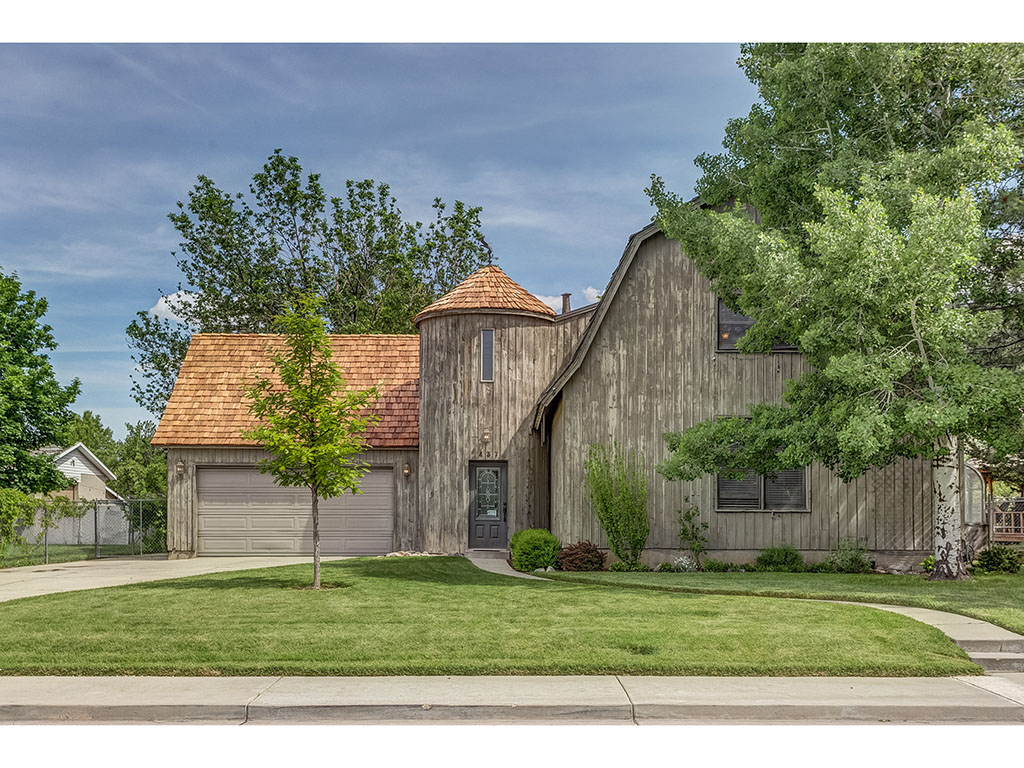26157 View Virtual Tour for 3D! Recent Price Reduction, come see this charming farm house, at $96 a square foot you can't find a better deal for this awesome north Orem neighborhood!
This beautiful storybook barn style home is a unique gem which stands out from the boring and ordinary. Built in 1981 by Claire Call, this custom builder’s home was constructed to stand the test of time. This home features a main floor master suite and defined spaces which flow naturally for entertaining and a busy lifestyle. Filled with European charm, the architecture features curved walls, exposed bricks, arched windows, hardwood and tile flooring, a creative office space at the top of the turret, and as you would expect a claw foot tub. A beautiful garden sunroom is off the kitchen, it is perfect for hosting parties, growing vegetables and enjoying a meal while feeling connected to the outdoors. The kitchen is considered a perfect cooking triangle, with double ovens, and a vented hood. The gourmet or home chef will appreciate the efficiency and quality of the space. The landscaping features wonderfully appointed mature trees for shade, lovely trumpet vines which attract hummingbirds, a large grapevine on the east side, and a porch swing. The exterior of the home has custom inlaid wood above the windows by local craftsman, Mike Rindlisbacher. When you buy this home you get an ideal Orem location, little traffic, walking distance to schools, minutes to Provo Canyon and shops at the Riverwoods and a community favorite the local Harmons which has the best artisan bread and organic produce. For buyers looking for a remarkable home with solid bones priced for buyer’s customization don’t miss out on this property which will surprise and inspire the next chapter in your life.
