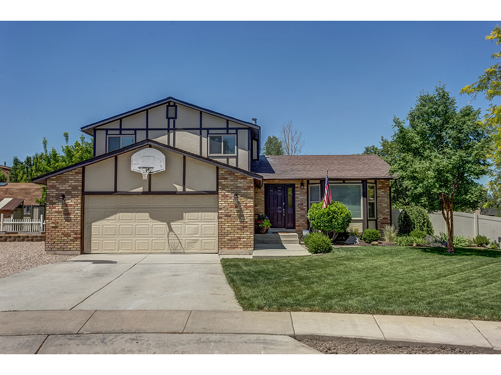 **Open House Saturday June 23, 11am-2pm**
The appeal of this upgraded turn key home begins the minute you drive up to the curb! With tidy landscaping and the greenest grass, you’ll enter the front door into the welcoming main level living area with coat closet and bay window before heading up the carpet lined knotty pine wooden stairs. Relax upstairs in the master bedroom with brand new carpet and en suite bathroom, along with 2 additional bedrooms, linen closet, and full bath with decorative glass vessel sink and dresser vanity.
Gatherings in your bright and airy kitchen with bay window eating area will be enjoyable as it overlooks the inviting family room with built-in shelving and sliding door access to the backyard. Tucked off the living space is a utility closet, separate laundry room, and sunny half bath.
There is a tucked away second living area, or “sports den” is perfect for game day viewing with space for TV, comfy sectional, and buffet table. Knotty pine wooden beams, posts, and a barn door to a large storage area really accent the space.
The backyard is waiting for your patio furniture so you can enjoy outdoor living in the privacy of a fully-fenced yard. Do not miss the charming side yard which is a gardener’s delight! You will find raised garden beds, a mature perennial herb garden, fruit trees, well-maintained grapevines that are loaded with grapes, a chicken coop with chickens included (if desired), and a large 16 x 12 shed. Conveniently control your sprinkler system remotely from the B-hyve automated sprinkler app, and park your RV or boat on the gravel driveway. The attached double car garage with natural light has built-in shelving and a workbench.
The owners have maintained this home well with recent improvements including new windows and blinds, new HVAC, new carpet, paint, and flooring.
Located on a quiet corner lot of a cul-du-sac, this is an amazing location with quick and easy access to Bangerter Highway, shopping/dining/entertainment at Jordan Landing, walking distance to beautiful Constitution Park, and a 5 minute drive to soccer fields and the Gene Fullmer Fitness and Recreation Center with indoor/outdoor pool. This home won’t last!