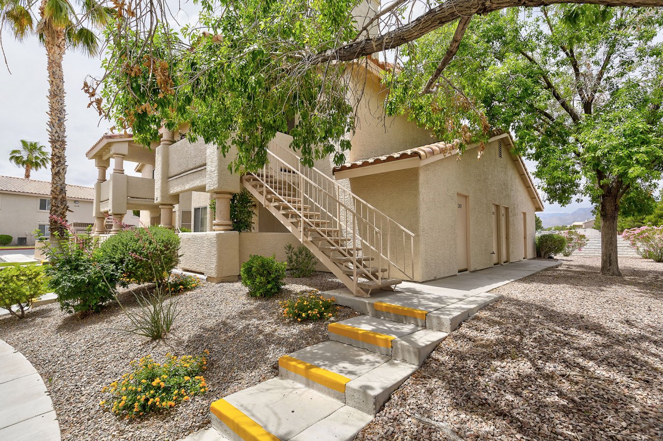 26815 Spacious, open and bright 2 bedroom 2 bath condo on the edge of Summerlin but without the fees. Summerlin's high school is one of the finest. Remodeled with new kitchen appliances, tile flooring, granite countertops and a 6'x3' breakfast bar. White faux wood blinds t/o, large bedrooms & closets. View of Red Rocks. Porcelain tile porch with private entrance. Exterior walk-in storage. 2 pools in this complex. This home shows like a model.