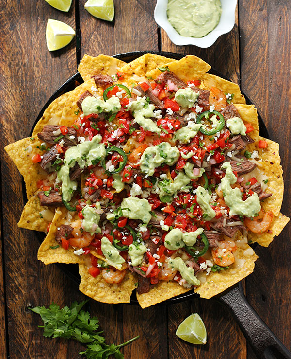 Grilled Surf 'n Turf Party Nachos with Avocado Cotija Sauce and Margarita Pico de Gallo from SoupAddict.com