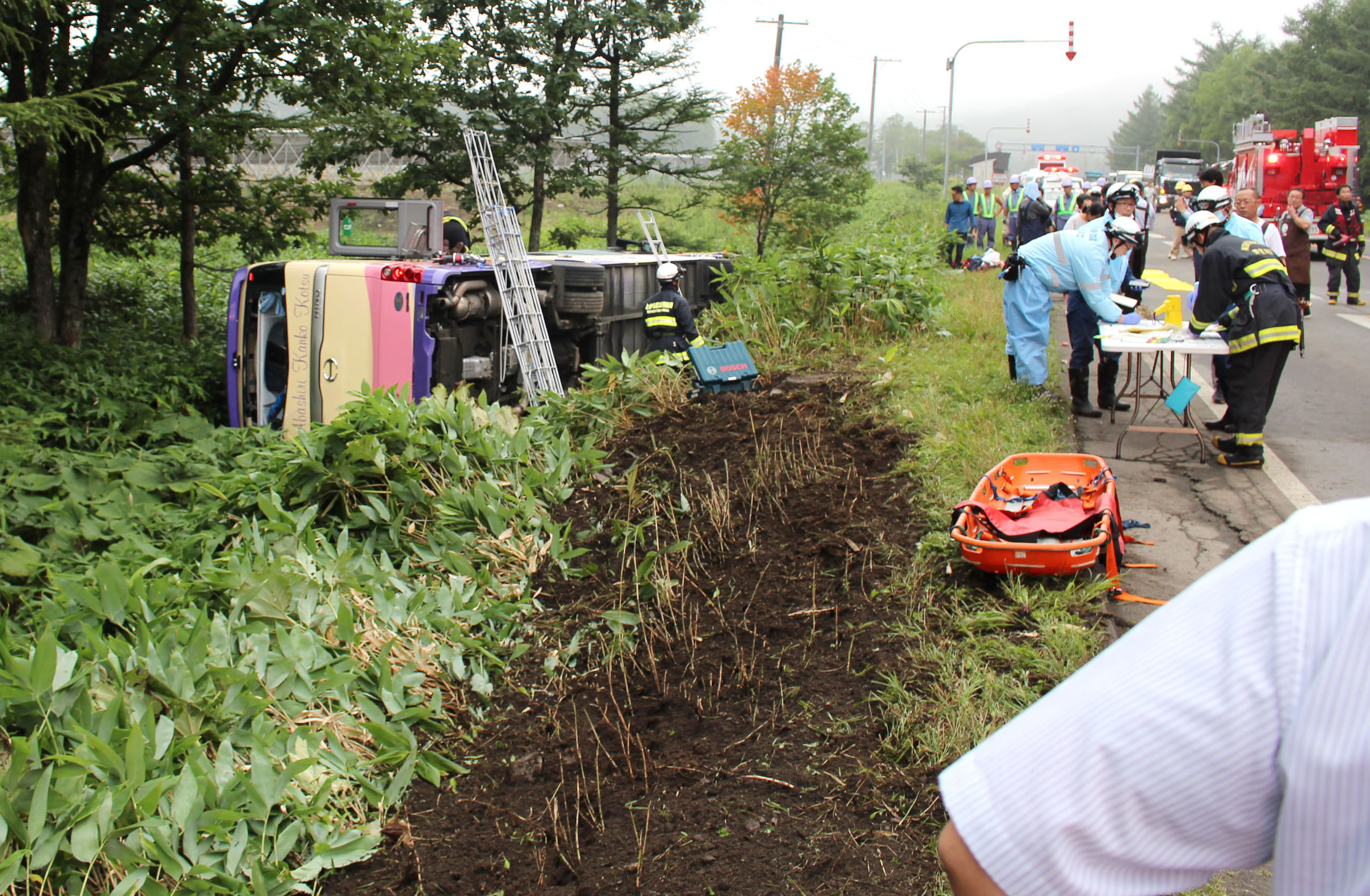 Tour bus falls off road and overturns in Hokkaido, dozens injured