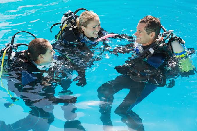 Diver practicing skills in a pool refresher course