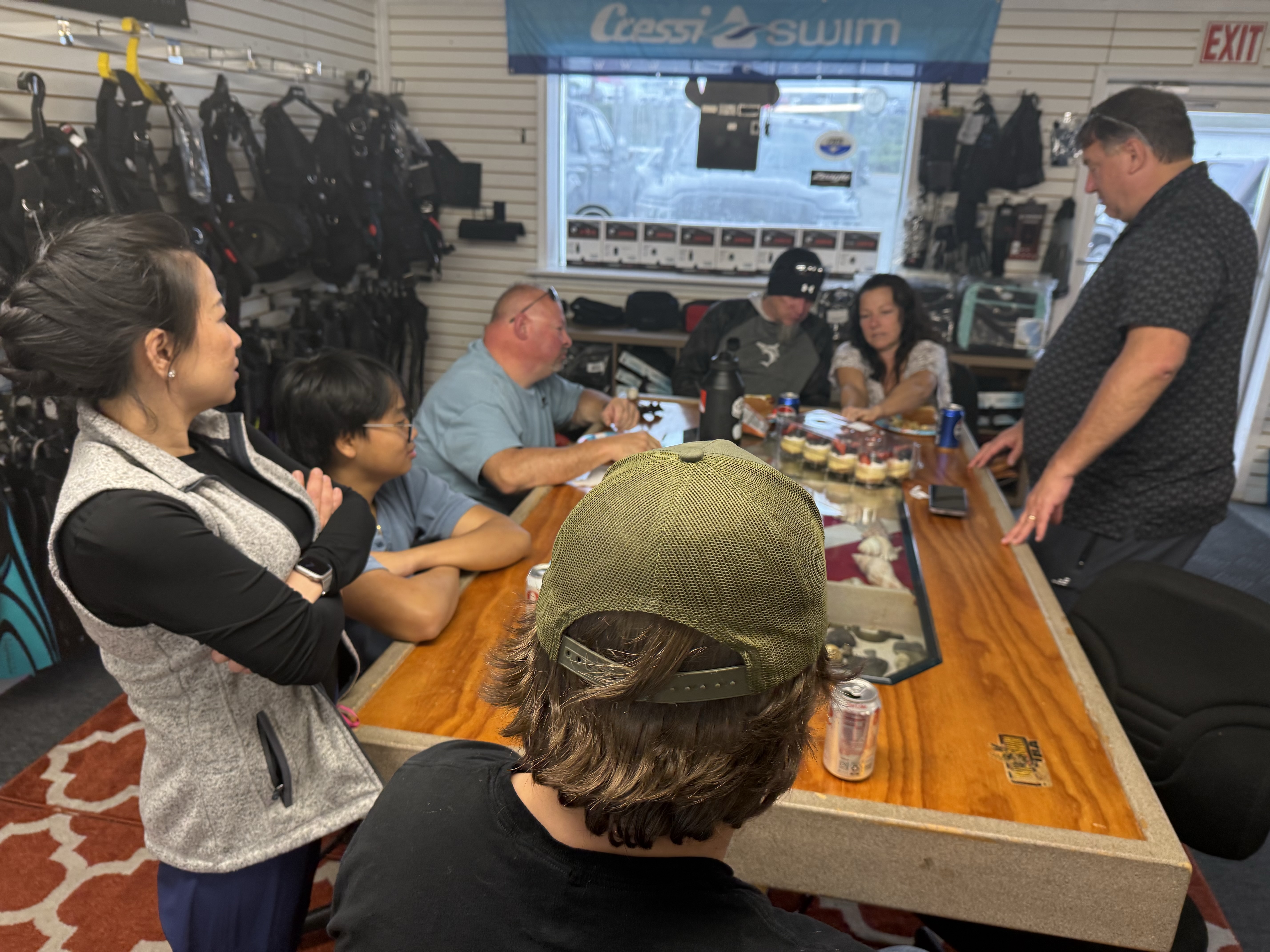 Scuba divers gathered for a pre-trip meeting at Sink or Swim Scuba in Gastonia NC