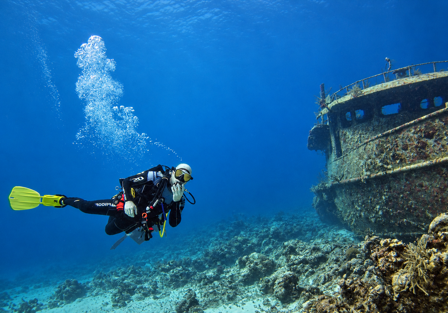 A scuba diver exploring a shipwreck in the Bahamas