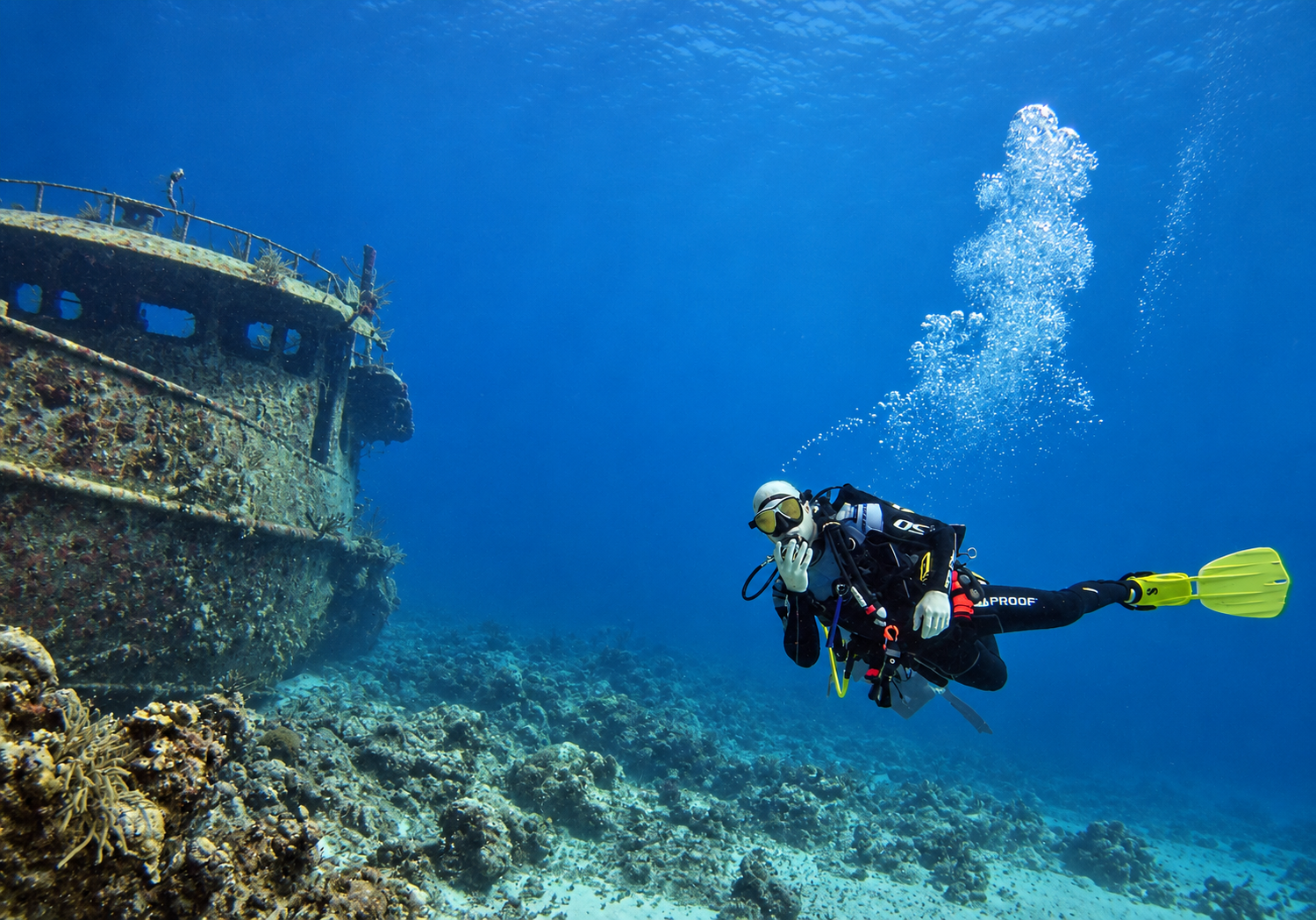 A scuba diver exploring a shipwreck in the Bahamas