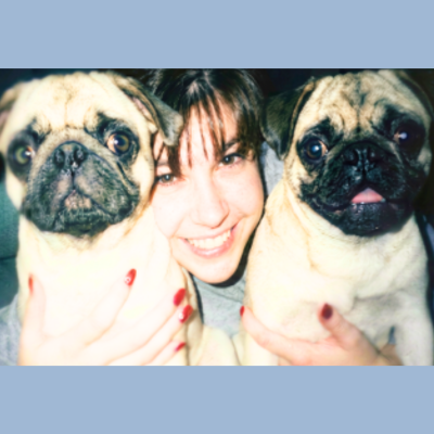 Angie with Dive and Glide Scuba's early pug mascots Lily and Jasmine