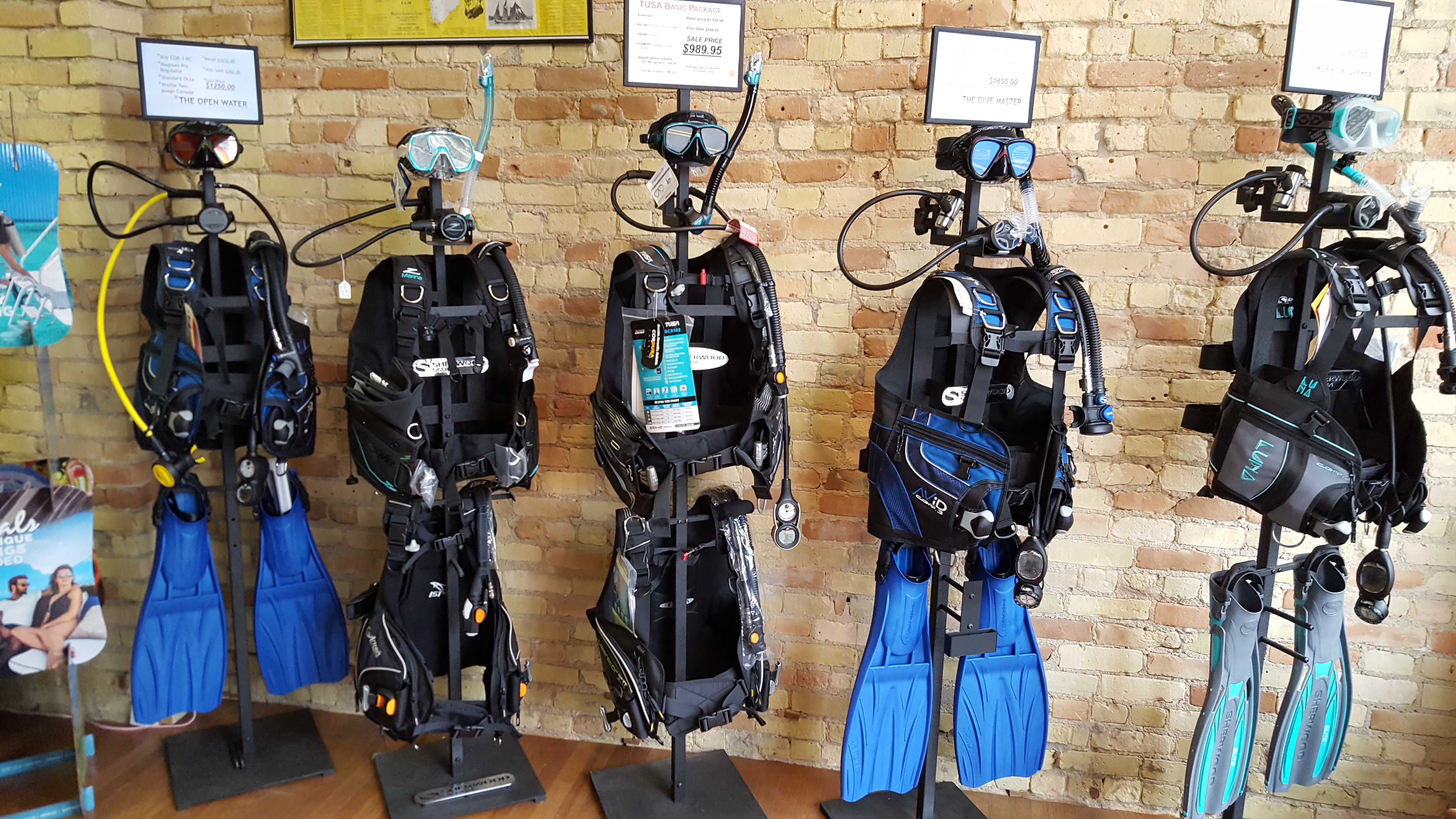 Complete scuba equipment setups displayed at Dive & Glide Scuba