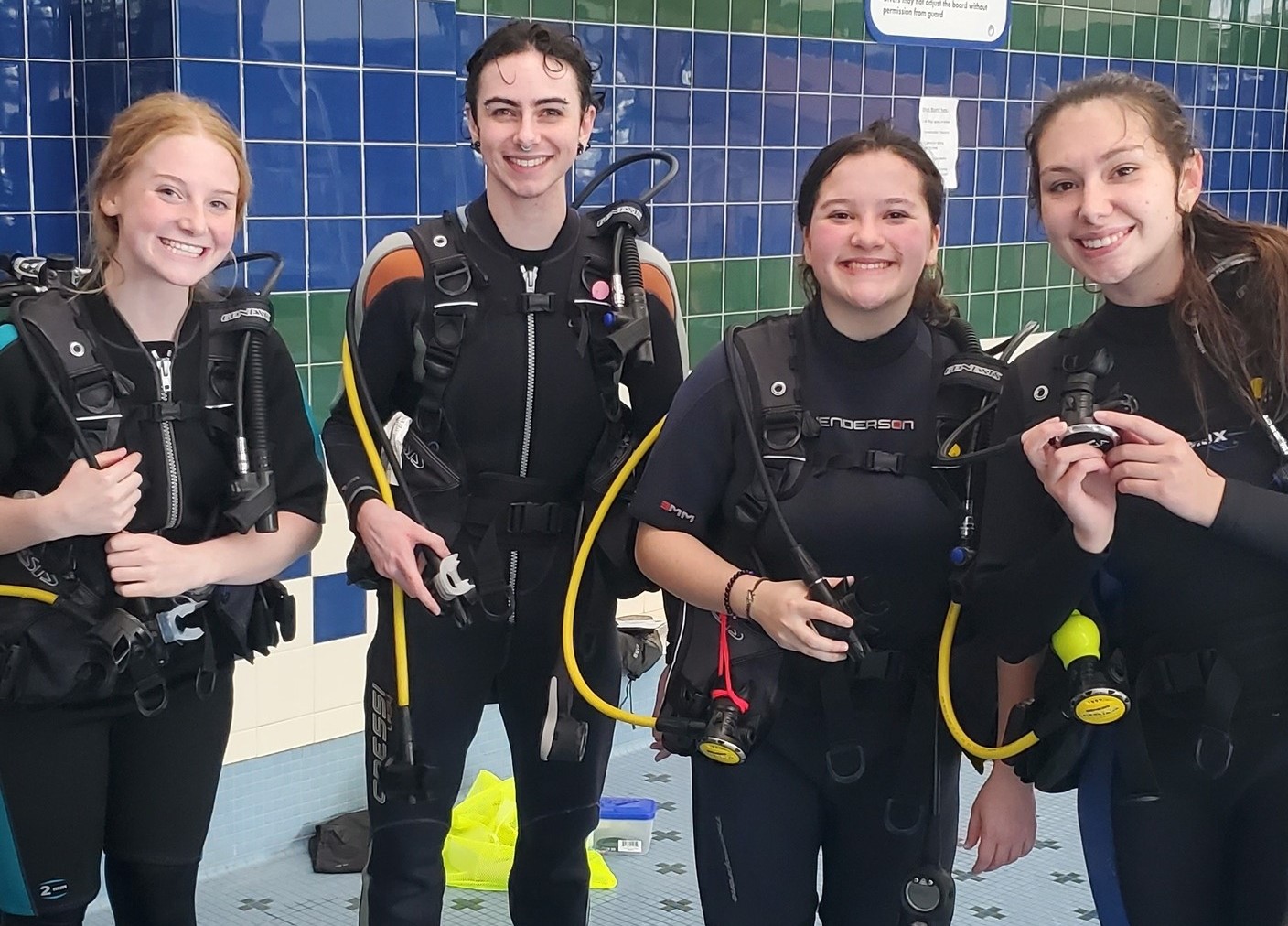 Smiling happy divers after pool session at Dive & Glide Scuba
