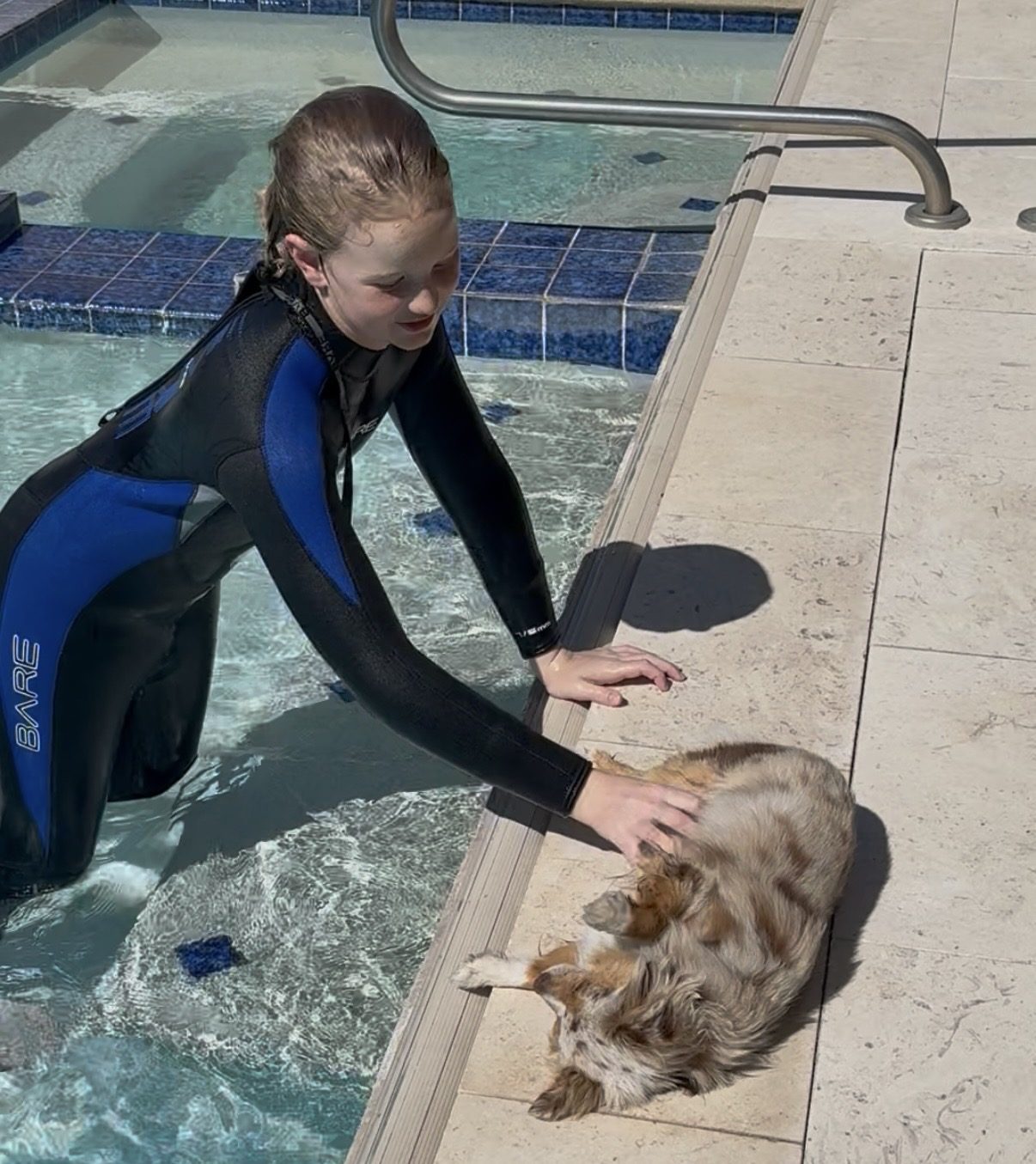Young student in a wetsuit at the edge of the Dive Arizona training pool