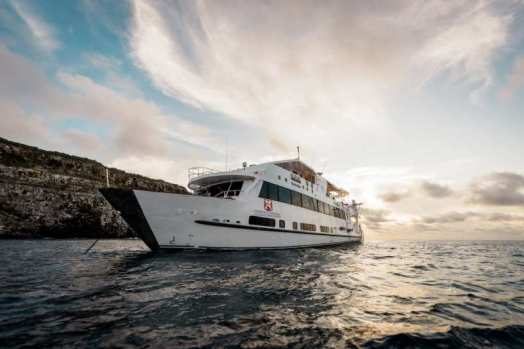 The Humboldt Explorer liveaboard at anchor in the Galapagos at sunset