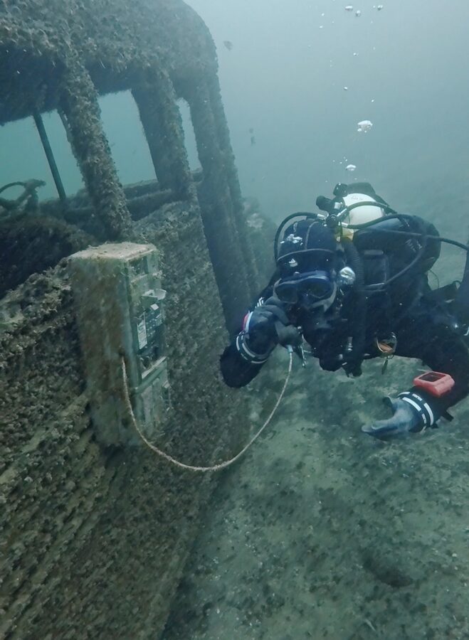 Diver exploring the sunken school bus at Lake Mohave, Arizona
