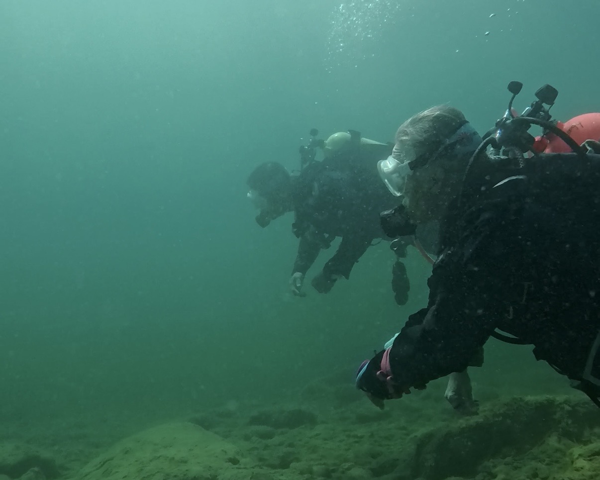 Two scuba divers exploring underwater at Lake Pleasant, Arizona