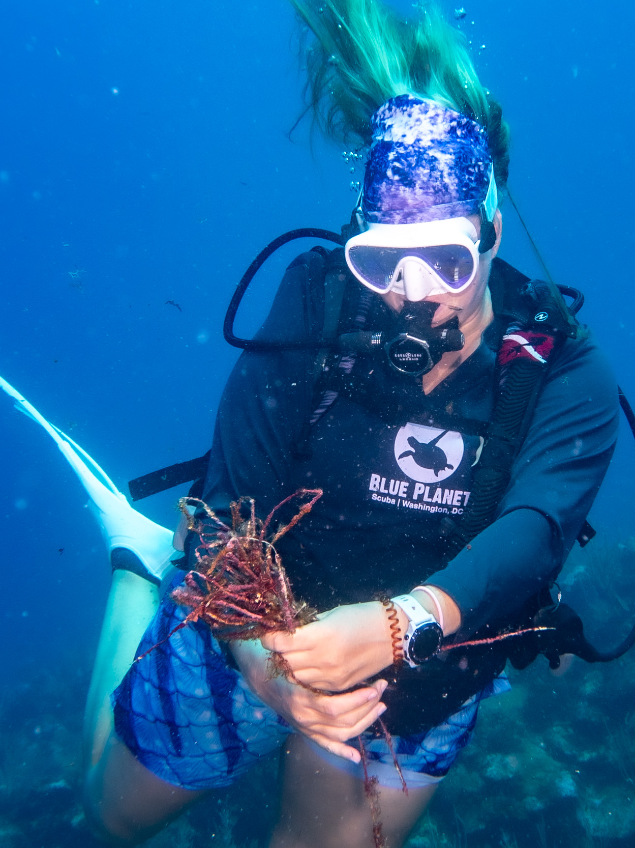 Jen with fishing line she pulled from the reef in Roatan
