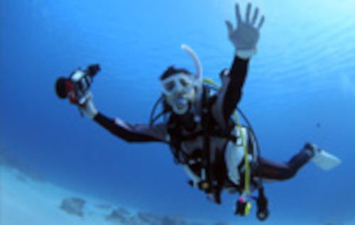 Happy diver underwater in Kona