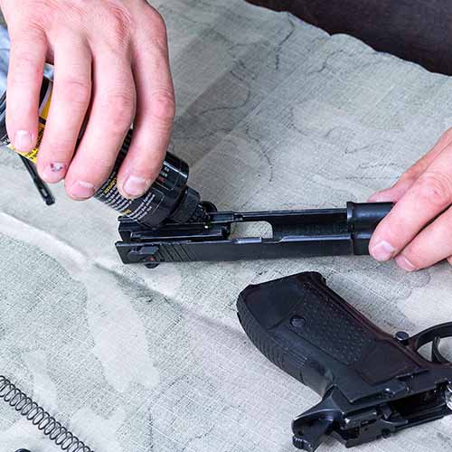 Firearm being cleaned