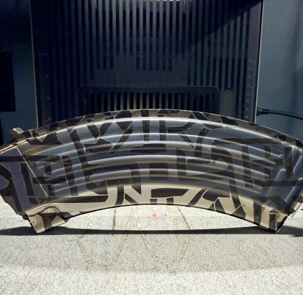 Laser engraving equipment mid-process on a custom piece