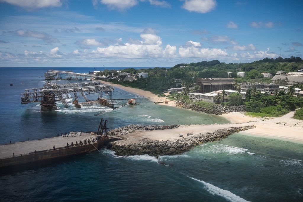 An aerial view of the cantilevers that were used to load phosphates from the mining site onto ships. Nauru's economy peaked in the early 1980s and has always been almost completely dependent on phosphate. Image by Vlad Sokhin