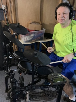 Jason Didner playing drums while recording Side Effects album