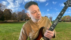 Jason Didner with his guitar - press photo for Side Effects