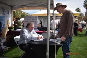 Author Ben Fine with an avid reader at the Tucson Festival of Books