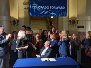 Dr. Medlock with cabinet leaders and Governor Polis at the BHA Bill signing in 2022. 