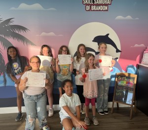 Skill Samurai students with certificates of completion