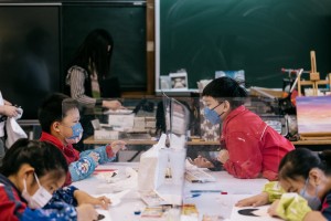 Students attending workshops & creating their artworks in our partnering school