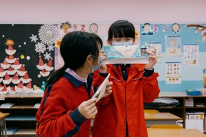 Students showcasing their drawings