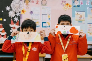 Students showcasing their drawings